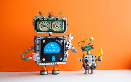 two toy robots on orange background